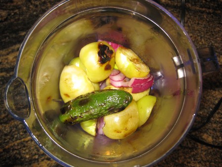 Grilled jalapenos, onions, tomatillos, and garlic before blending