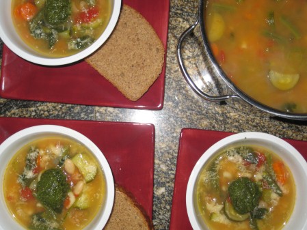 Soup with pesto & parmesan garnish